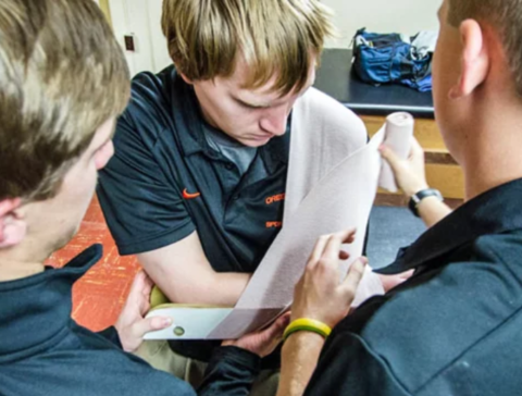 Student learning to splint an arm. 